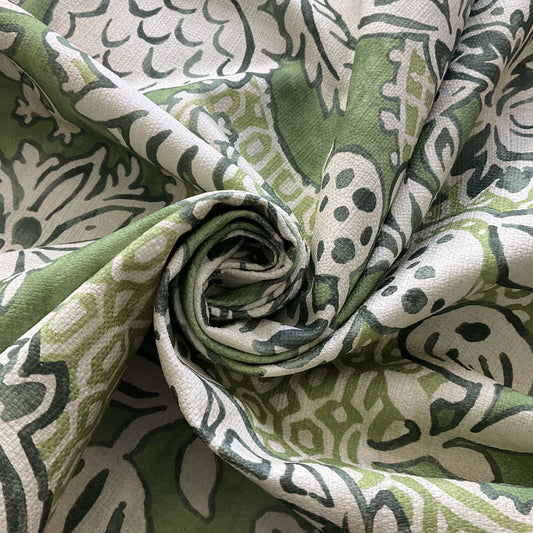Close-up detail of verdant tapestry fabric with green leaves
